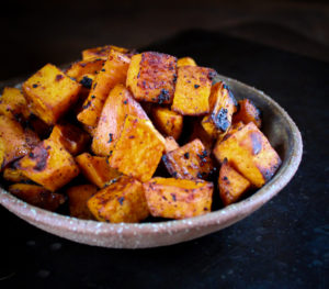 a bowl of chili roasted sweet potatoes