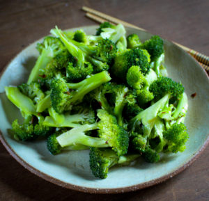 a plate of vegan broccoli salad